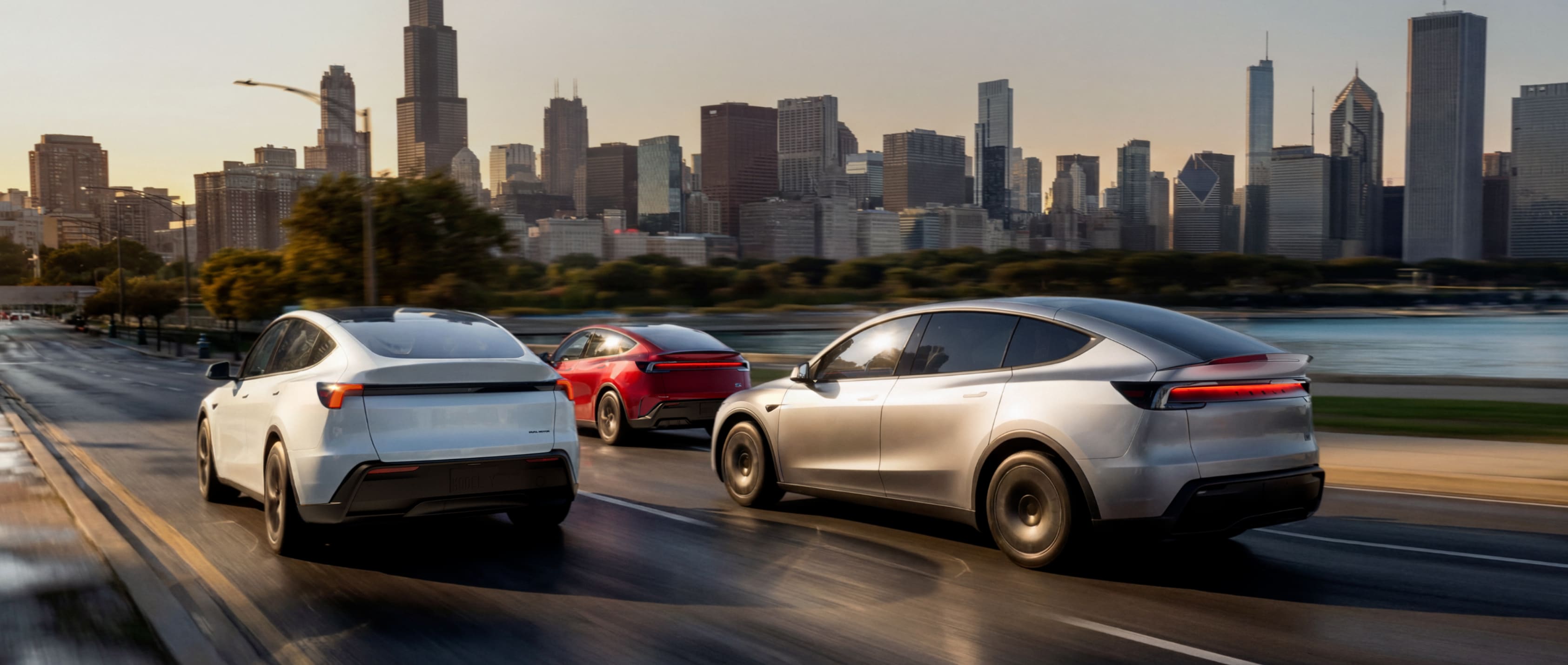 Model Y with a family beside a modern home